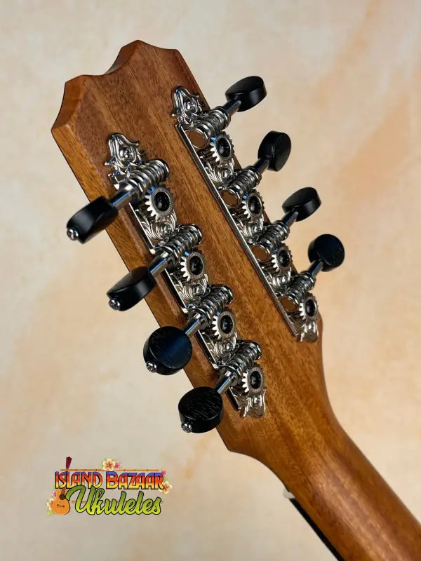 Guitar headstock with chrome tuning pegs on Kanile’a Eight String Tenor Ukulele Koa Wood