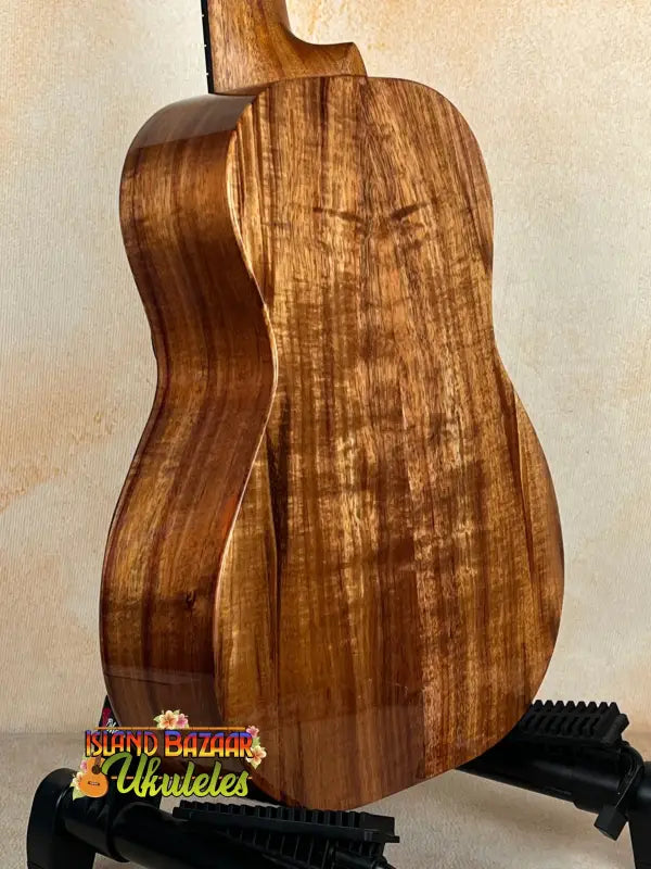 Acoustic guitar featuring richly grained Koa wood in Kanile’a Eight String Tenor Ukulele