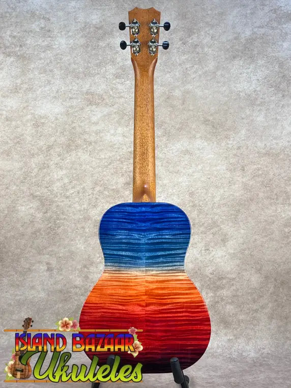 Vibrant ʻilikai t pro tenor ukulele with blue-to-orange-to-red gradient