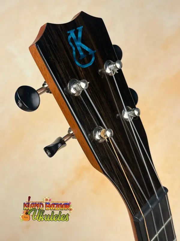 Ukulele headstock with tuning pegs and strings of the Kanileʻa ʻILIKAI T Pro Tenor Ukulele