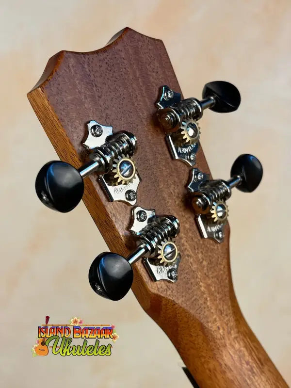 Guitar headstock with black tuning pegs and chrome hardware for Kanile’a K-2 Premium Ukulele