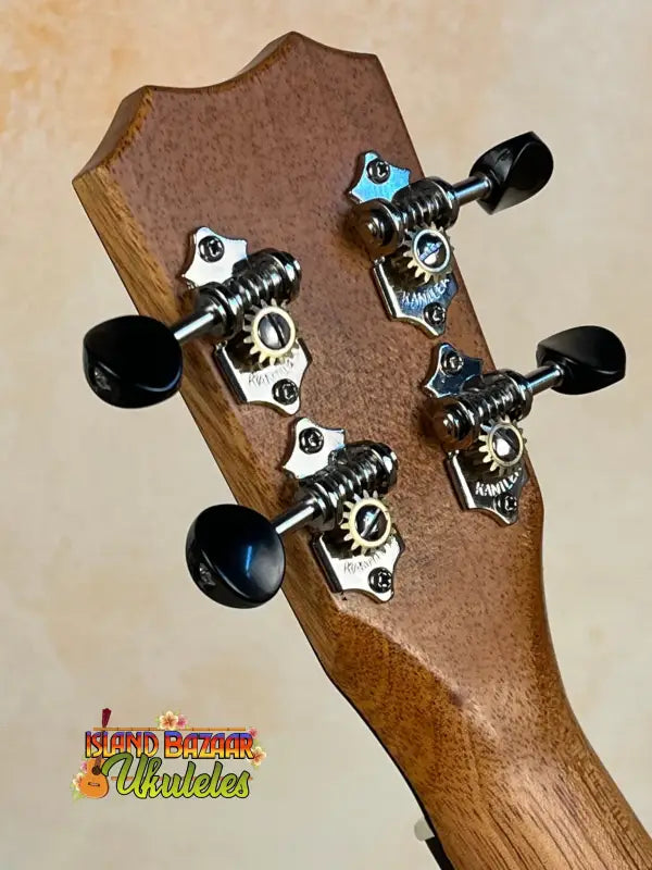 Guitar headstock with black tuning pegs on Kanile’a K-3 Tenor Ukulele - Master Grade Curly Koa