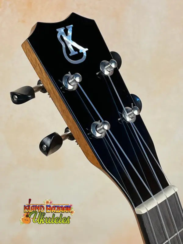 Black guitar headstock with silver tuning pegs for Kanile’a K-3 Tenor Ukulele