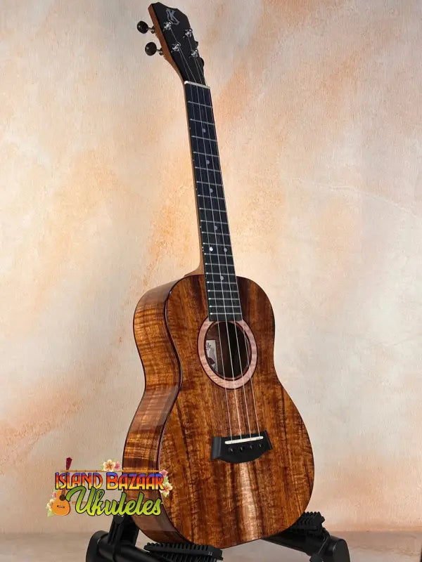 Beautiful Kanile’a K3-T Tenor Koa Ukulele with dark fretboard and decorative rosette