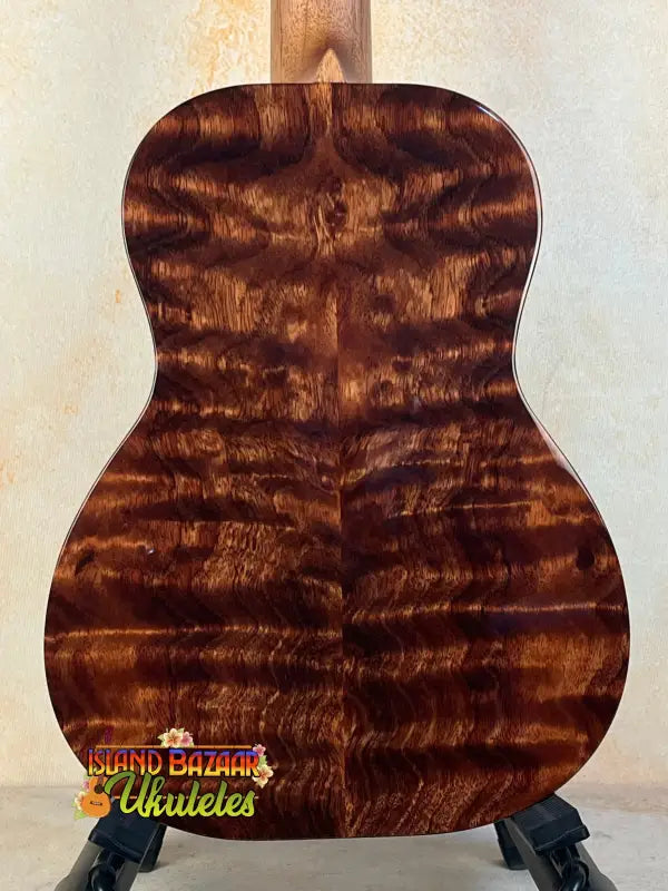 Acoustic guitar back featuring rich tiger-striped wood of Kanilea KPA Master-Grade Tenor Ukulele