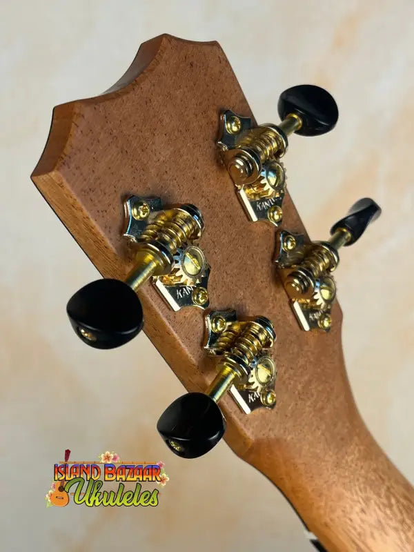 Guitar headstock with gold tuning pegs on Kanilea KPA Premium Koa Tenor Ukulele