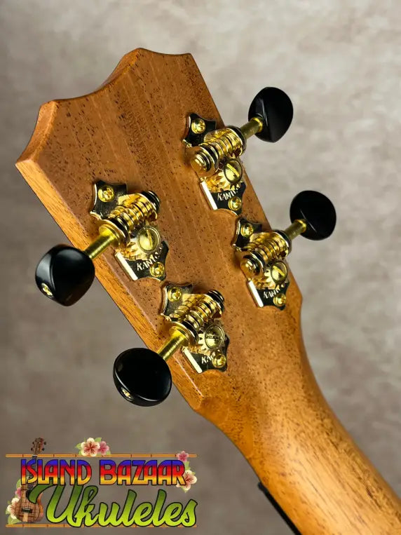 Back of Kanile’a KPA Pro Tenor Koa Ukulele headstock with gold tuning machines