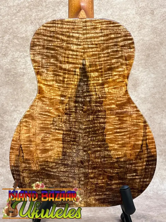 A kanile’a kpa pro tenor ukulele with a premium solid hawaiian koa body and polished golden-brown finish