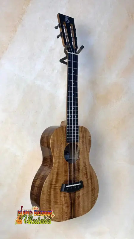 Beautiful Koa wood Kanilea KSR Premium Tenor Ukulele with dark fretboard and strings