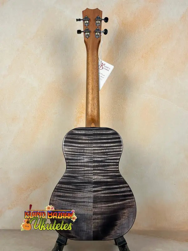 Back of a black and gray Kanile’a KPA Pro tenor ukulele with deluxe gig bag