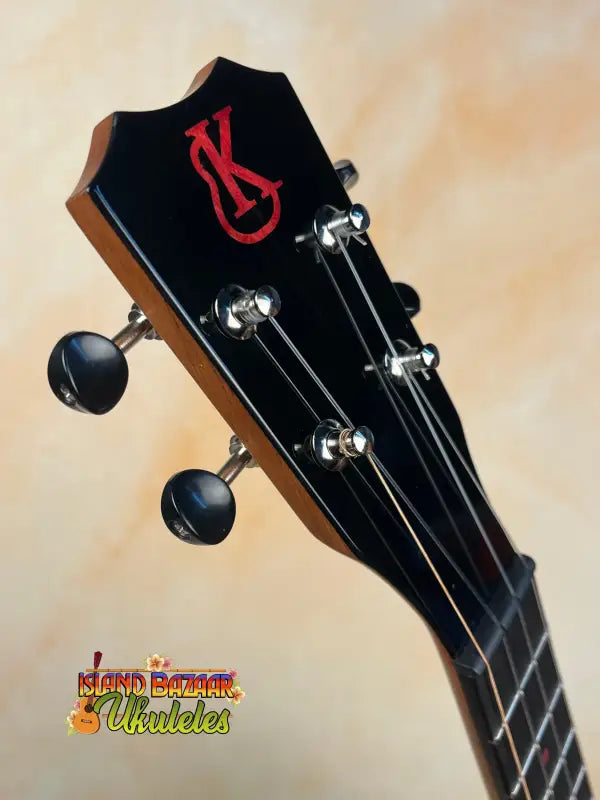 Black ukulele headstock with tuning pegs on Kanile’a KPA Pro Tenor Ukulele with Deluxe Gig Bag