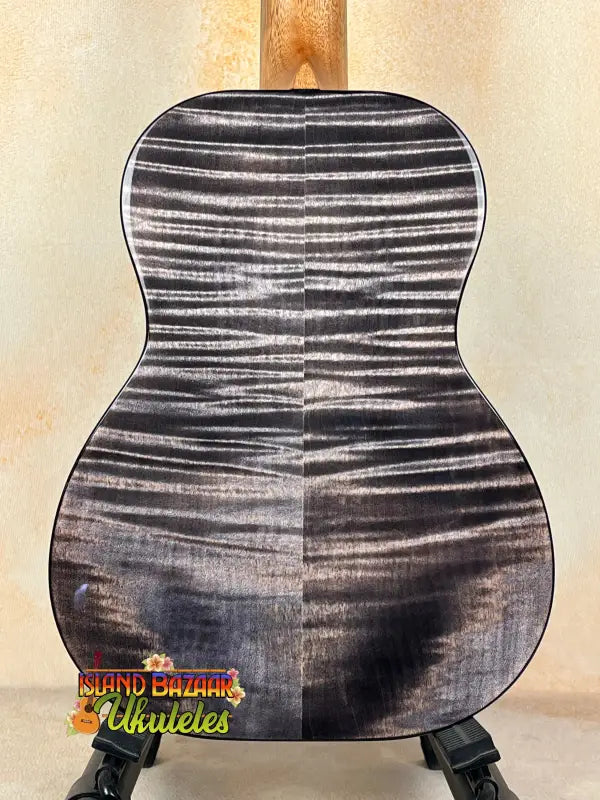 Black and white striped ukulele back featuring Kanile’a KPA Pro Tenor with deluxe gig bag