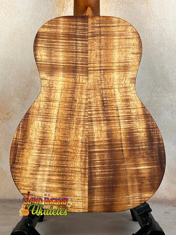 Acoustic guitar featuring a stunning figured Koa wood back panel from Kanile’a K-2