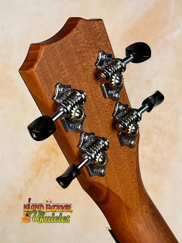 Guitar headstock with black tuning pegs and chrome hardware on Kanile’a K-2 Premium Koa Tenor Ukulele