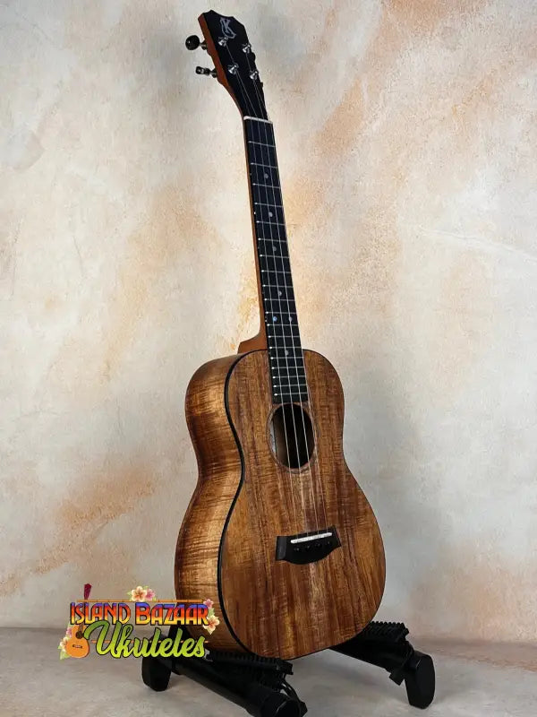 Beautiful Kanile’a K-2 Premium Koa Tenor Ukulele displayed on a black stand
