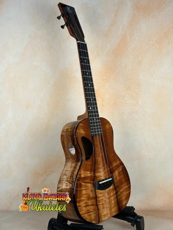 Beautiful Koa wood Kanile’a Super Tenor D-Hole Premium Koa Ukulele with curly grain patterns