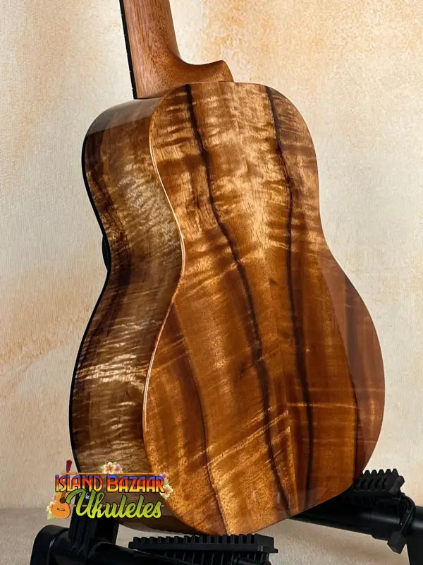 Kanile’a Super Tenor D-Hole Premium Koa Ukulele showcasing beautiful koa wood grain