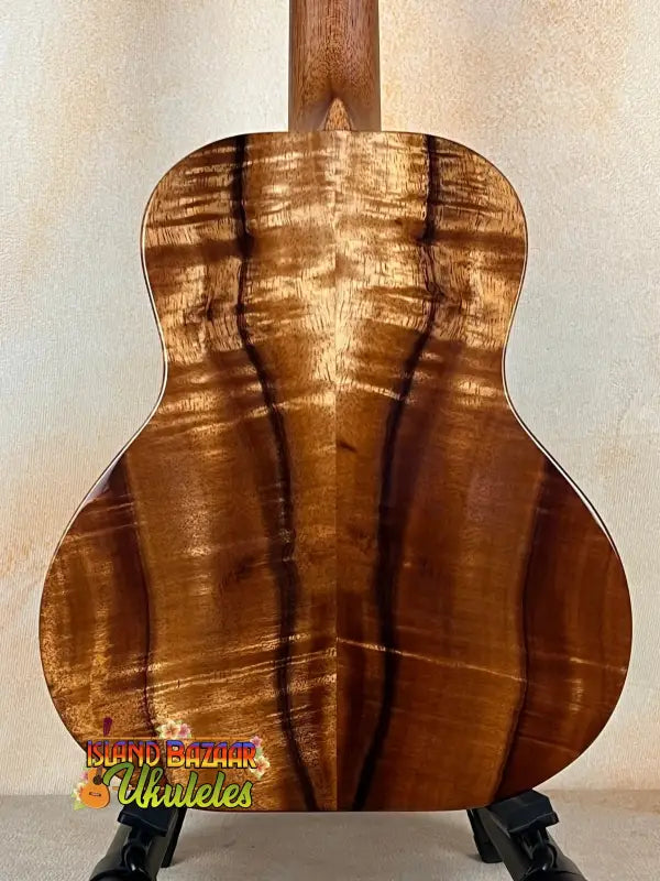 Kanile’a Super Tenor D-Hole Premium Koa Ukulele with striking tiger-stripe wood grain