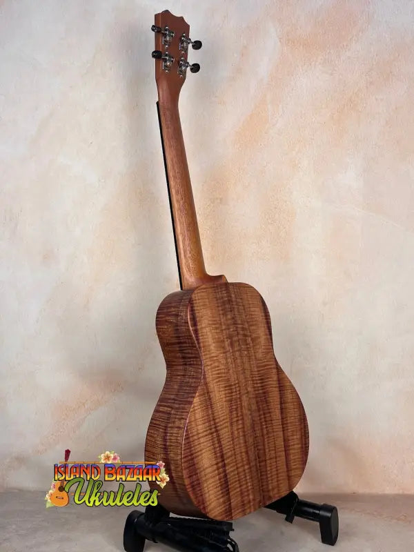 Wooden Kanile’a Super Tenor Ukulele showcasing premium koa wood grain pattern