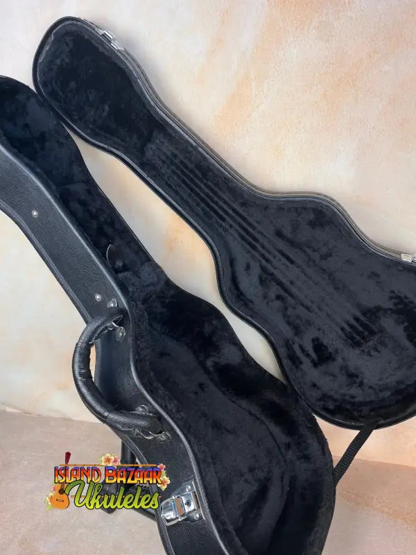 Black hardshell guitar case with latches for Kanile’a Super Tenor Ukulele, Premium Koa
