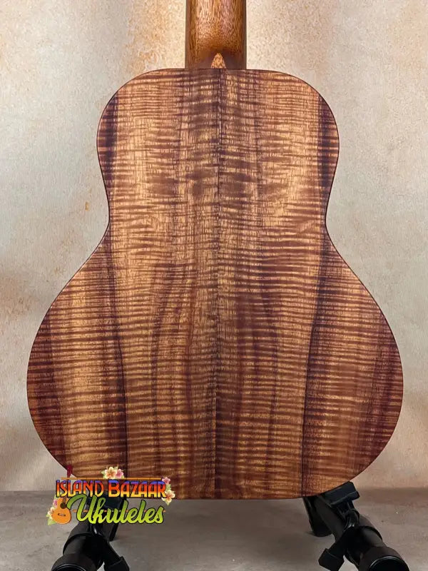 Acoustic guitar showcasing striking figured Koa wood, Kanile’a Super Tenor Ukulele