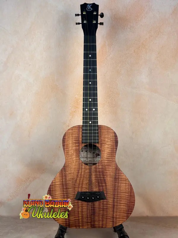 Beautiful Kanile’a Super Tenor Ukulele showcasing premium koa wood and sleek black hardware