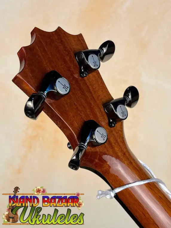 Guitar headstock with black tuning pegs on KoAloha Concert Hawaiian Ukulele, Solid Koa