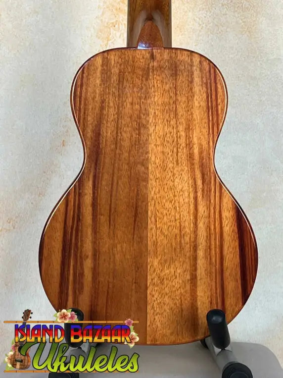 Acoustic guitar with solid Hawaiian Koa back, featured in KoAloha KCM-00 Concert Ukulele