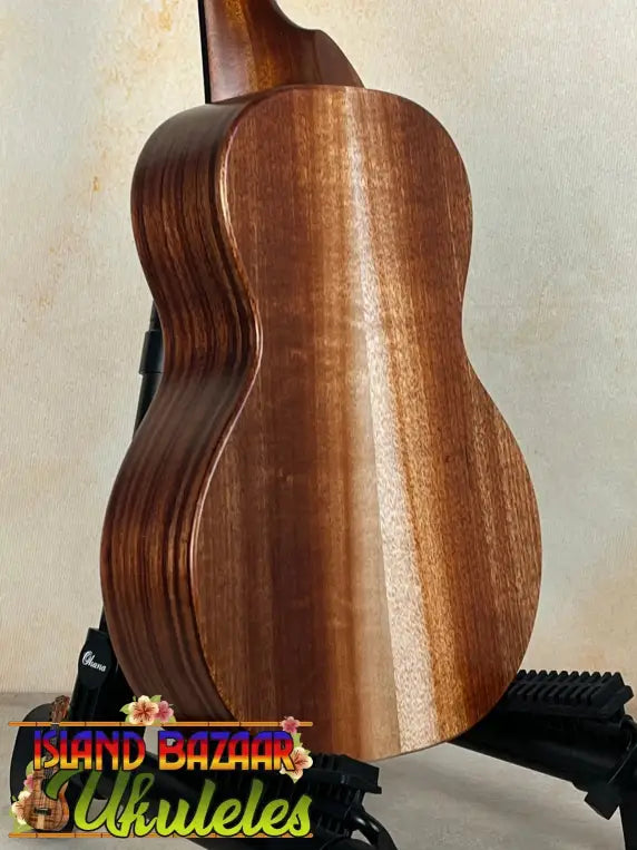 Wooden acoustic guitar in rich brown mahogany, KoAloha KCM-10RP Royal Pikake design