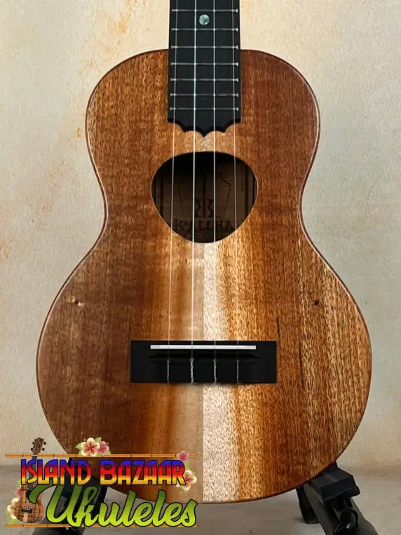 Wooden ukulele with natural finish and black fretboard, KoAloha KCM-10RP Royal Pikake