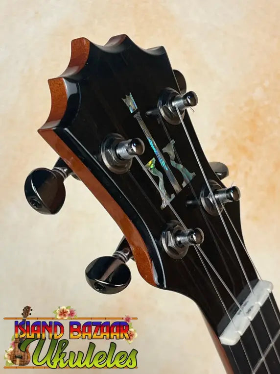 Guitar headstock with black tuning pegs and inlay for KoAloha KSM-00 Featured Soprano Ukulele