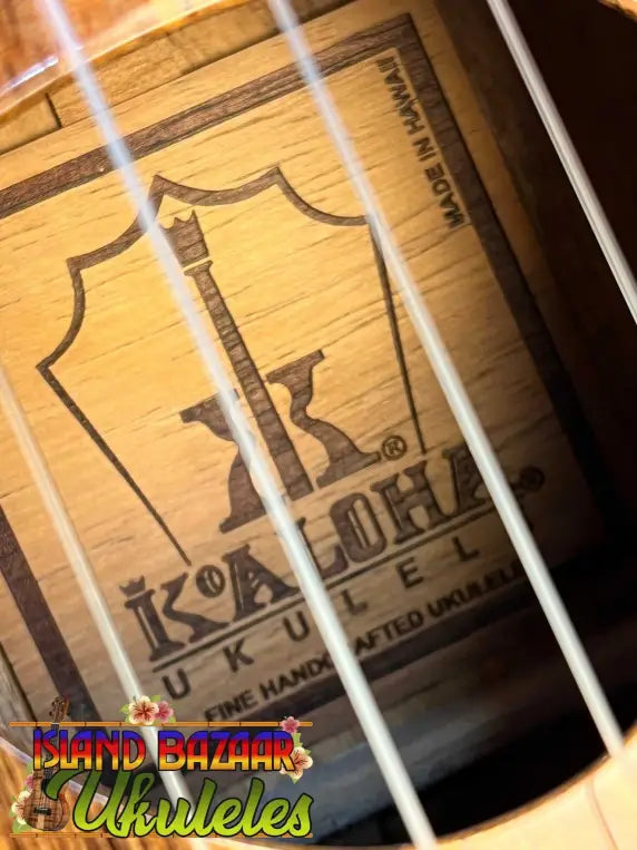 Ukulele interior label and strings in the KoAloha KSM-00 Soprano with Hawaiian Koa