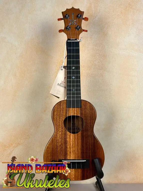 Wooden KoAloha KSM-00 Soprano Ukulele with Hawaiian Koa and Ebony Fretboard on stand