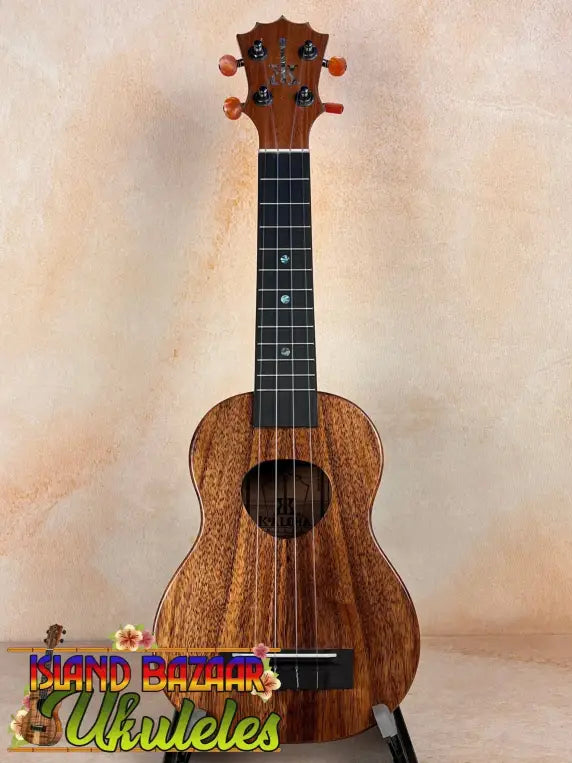 Wooden KoAloha KSM-10 Soprano Ukulele with solid Hawaiian koa, dark grain, and black fretboard