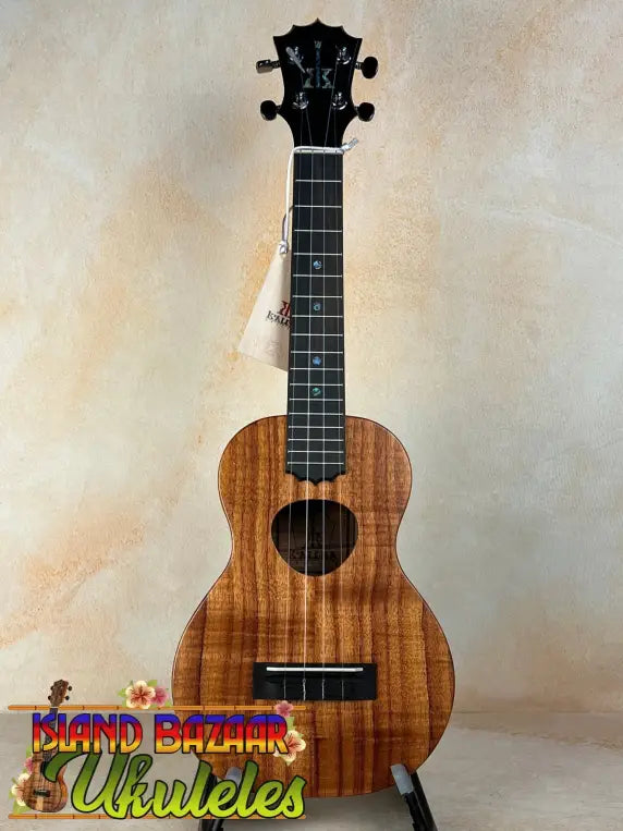 KoAloha Royal Pikake Concert Ukulele KCM-00RP with Koa wood body and black fretboard