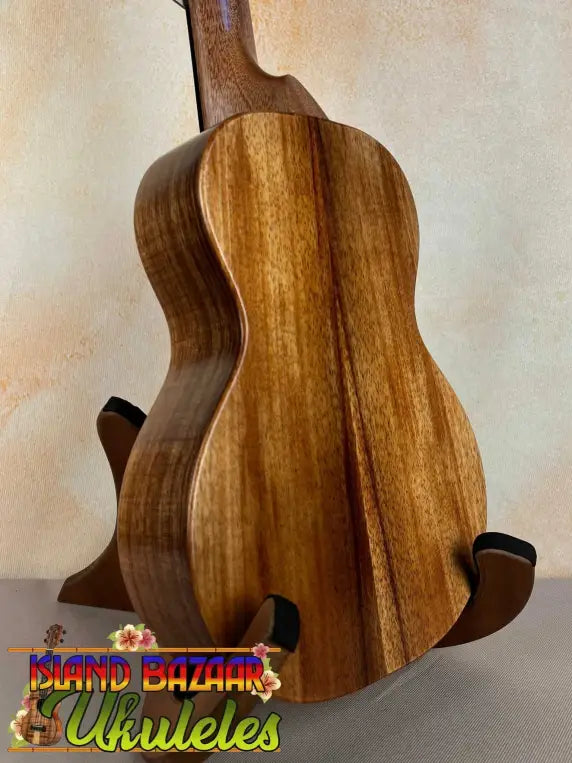 Wooden ukulele showcasing rich koa wood grain in KoAloha Royal Pikake Concert model