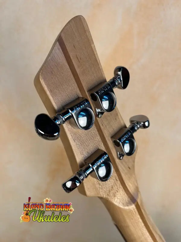 Guitar headstock with black tuning pegs on Mann Electric Tenor Ukulele solid body