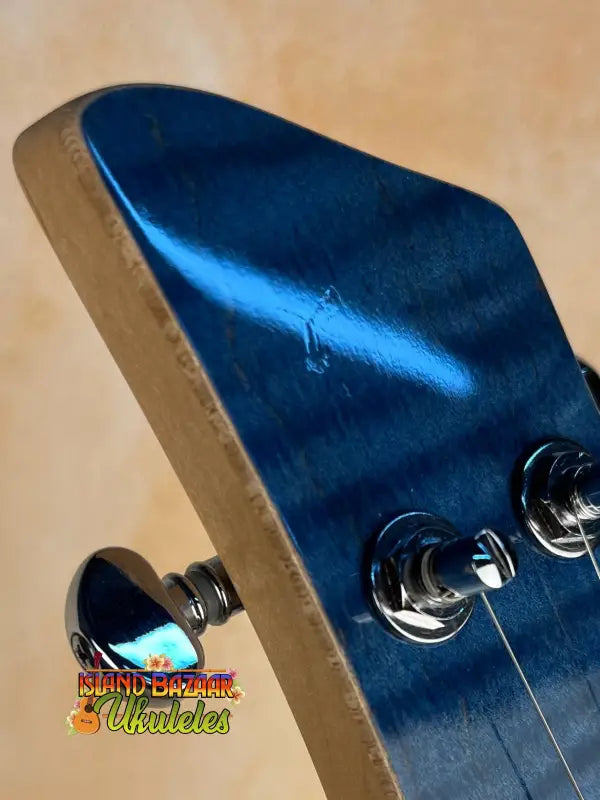 Electric guitar headstock in metallic blue for Mann Electric Tenor Ukulele solid body