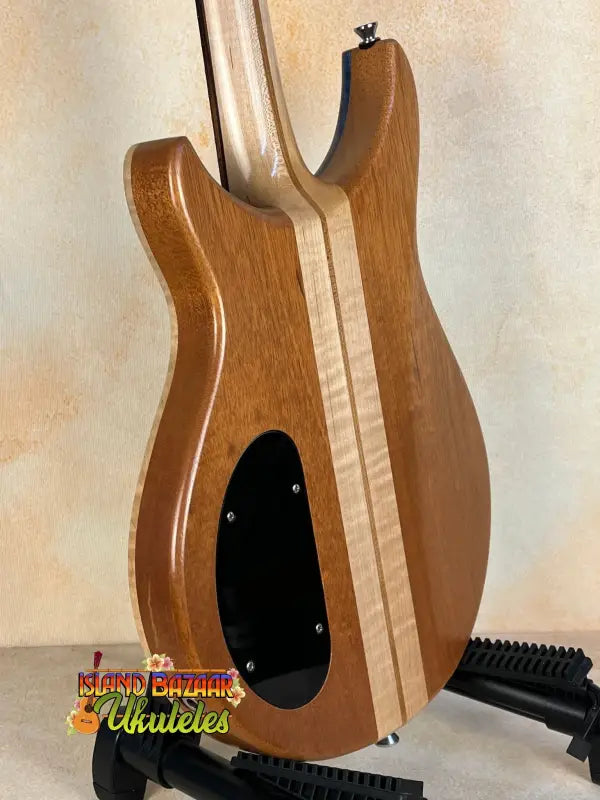 Wooden electric guitar body with light center stripe, Mann Electric Tenor Ukulele design