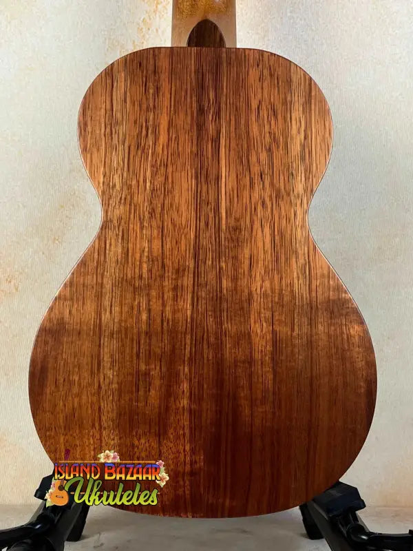 Wooden acoustic guitar with rich brown grain patterns for Kamaka HF-2 Solid Koa Ukulele