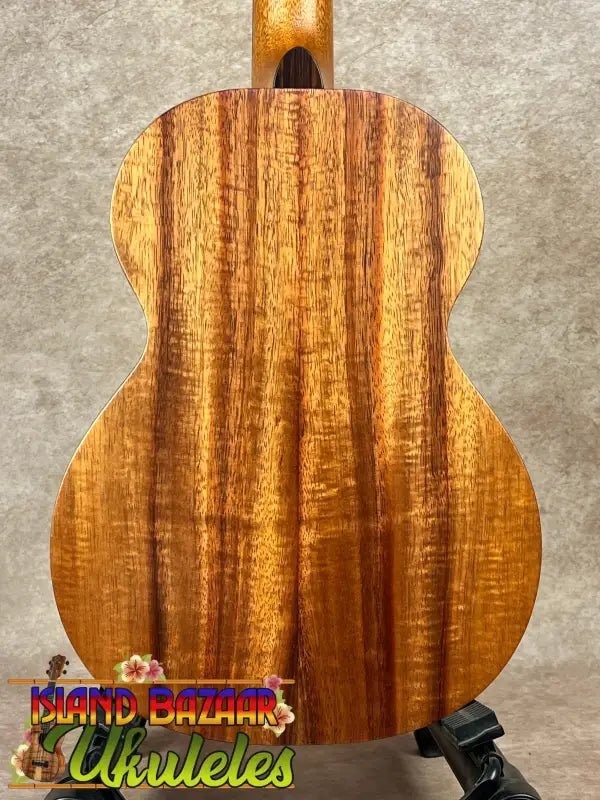 Wooden ukulele back showcasing the Kamaka HF-3 Tenor Ukulele in solid Koa wood