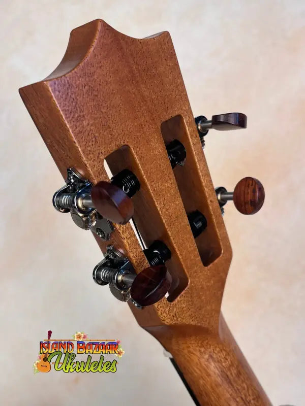 Wooden guitar headstock with tuning pegs on Kamaka HF-3I Slothead Tenor Ukulele