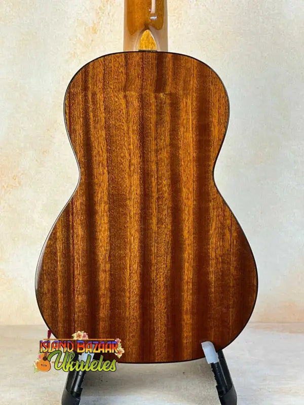Ohana CK-35G Solid Mahogany Concert Ukulele with vertical grain on a stand