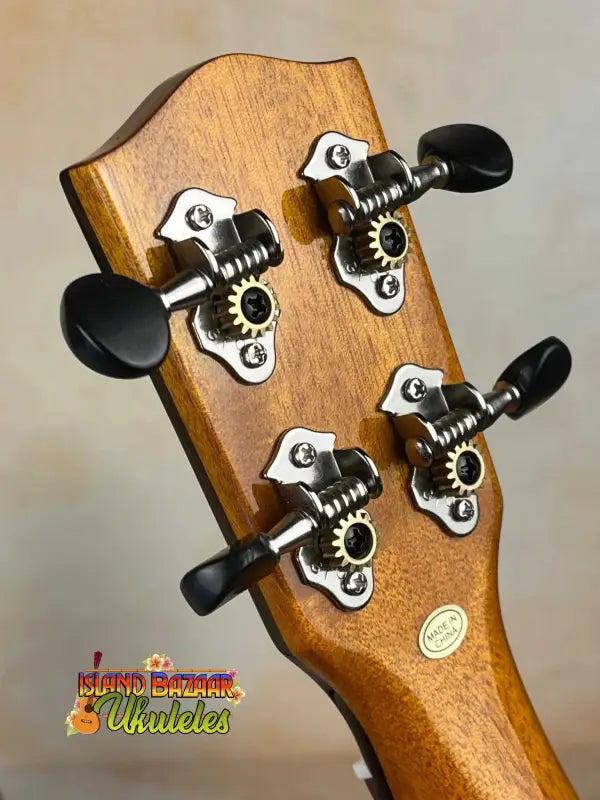 Wooden guitar headstock with black tuning pegs on Ohana CK-35G Solid Mahogany Concert Ukulele