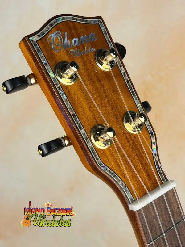 Ohana CK-370G Concert Ukulele headstock with gold tuning pegs and decorative binding