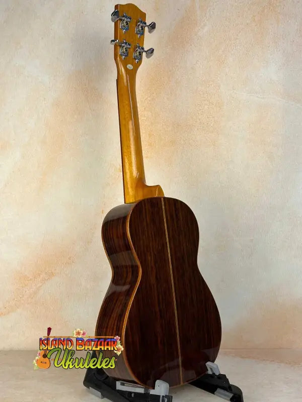 Wooden baritone ukulele with dark rosewood body and maple neck in Ohana CK-50G design