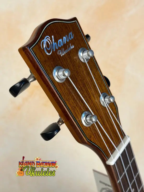 Ohana CK-50WG Concert Ukulele headstock with silver tuning pegs and dark wood finish
