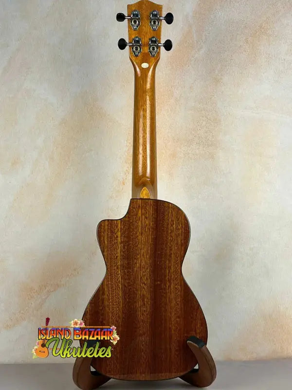 Ohana CK-60CG Mahogany Concert Ukulele with cutaway, dark brown body on stand