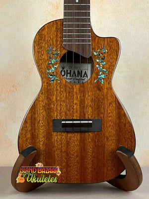 Wooden Ohana CK-60CG Mahogany Concert Ukulele with blue floral designs near sound hole