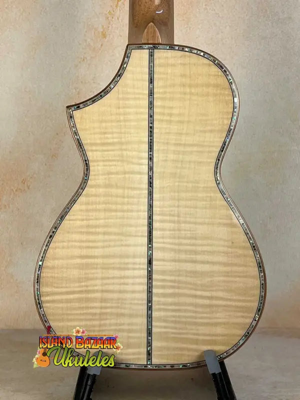 Back view of Ohana CK-75CG Concert Ukulele showcasing flamed maple wood and decorative binding